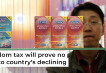 A Chinese visitor looks at condoms at the Beijing International Sex Supplies Exhibition. Zhang Peng/LightRocket via Getty Images